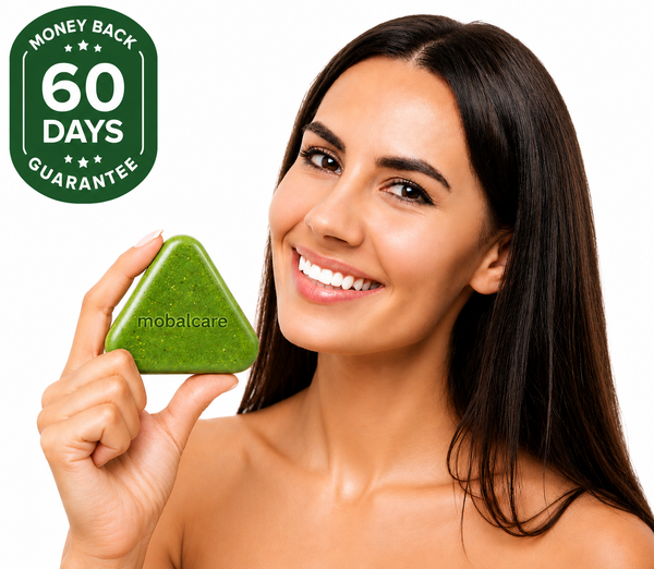 Smiling woman holding softgel
